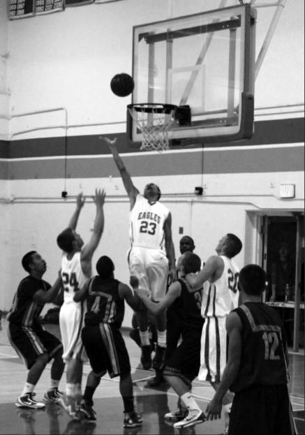 Junior Derek Breaux reaches for a rebound in a rebound in a game against Wilcox. The Eagles are top in the De Anza Division with an overall record of 14-5.