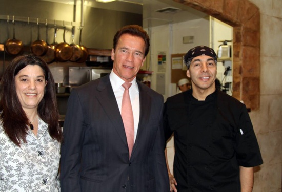 Governor Arnold Schwarzenegger poses with the owners of Zitune in downtown Los Altos.