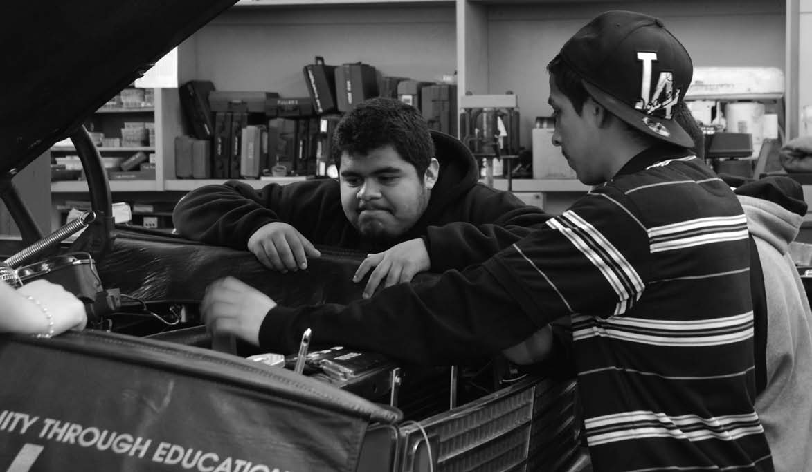 Autoshop students learn how to install radiators during class. Practical skills like this could eventually prove helpful in the future.