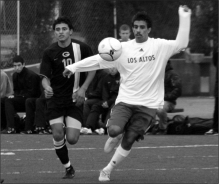 Junior Juan Morales concentrates on trapping the ball during a game against Gunn. The Eagles lost 1-0 but hope to win tomorrow's rematch.